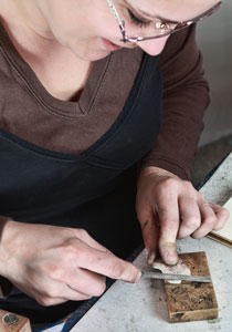 jeweler using a file