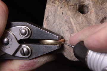 drilling a hole in a ring