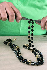 jewelry worker making a necklace